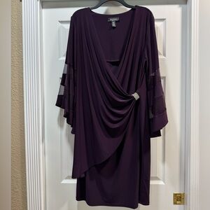 Beautiful faux wrap dress with bell sleeves. Sleeves have sheer panels